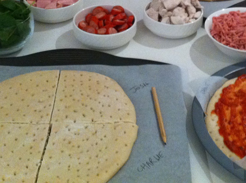 make your own pizza label the baking paper with guests names
