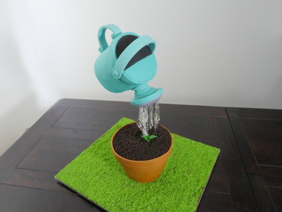 watering can cake gravity defying cake