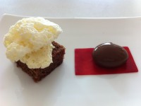 chcolate spherical served with raspberry agar gel, vanilla air and chocolate brownie