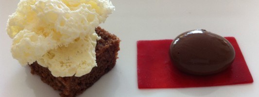 chcolate spherical served with raspberry agar gel, vanilla air and chocolate brownie